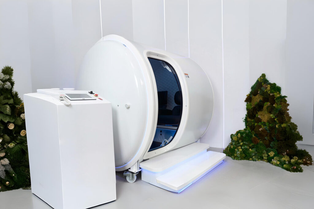 White cylindrical chamber with control unit and decor in a minimalist room.